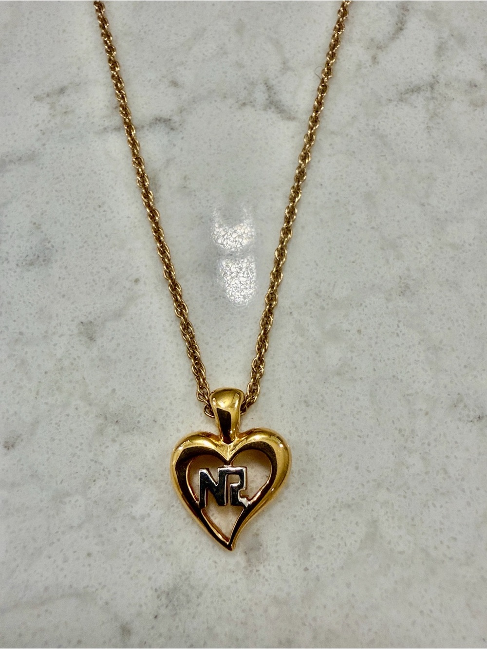 Nina Ricci Gold Heart Pendant Necklace with Dark Initial Accent